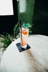glass of juice on wooden table