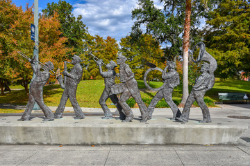 Sculpture of a music band in the Louis Armstrong park in NOLA (USA) - obrazy, fototapety, plakaty