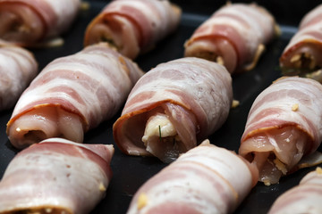 Chicken, cheese and bacon rolls. The process of cooking in the oven.