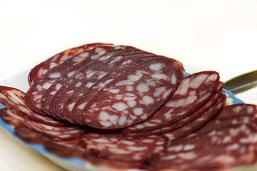 Smoked sausage with fat cut into rings