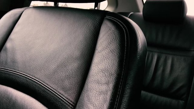 black leather upholstery in the interior of a luxury business class car.