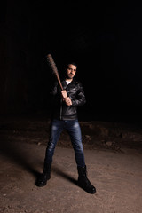 Fototapeta premium man in leather jacket and baseball bat
