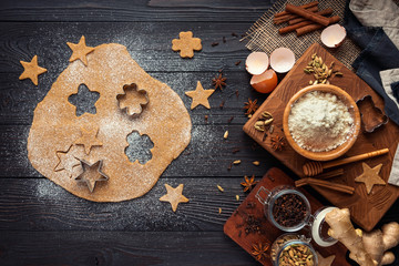 ingredients for baking ginger cookies on a rustic wooden background, view from above