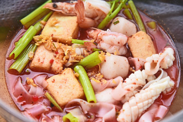 Thai street food Pink seafood flat noodles soup.(Thai name is Yentafo)