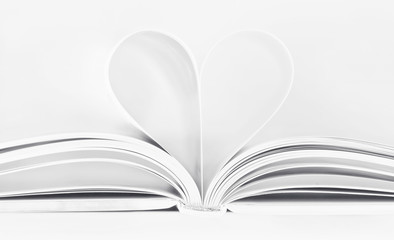 open book with heart shaped pages on white