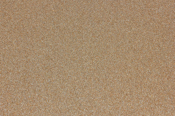 Fototapeta na wymiar Yellow sand marine structure background of the homogeneous beige