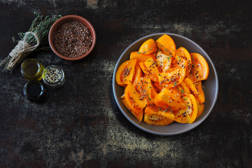 Vegan salad with yellow tomatoes and flax seeds.