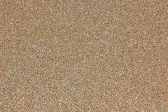 Yellow sand marine structure background of the homogeneous beige