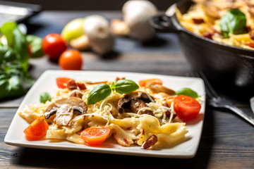casserole  pasta with mushrooms, sausage and cheese