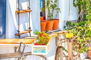 Fototapeta na wymiar Old School Rusty Bicycle in Front of House in Santorini Island in Greece.