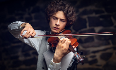 young violinist playing violin.