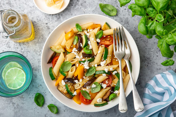 pasta salad with grilled vegetables ( zucchini, eggplant, bell pepper ant tomato) and feta cheese