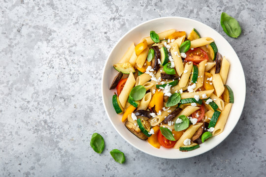pasta salad with grilled vegetables ( zucchini, eggplant, bell pepper ant tomato) and feta cheese