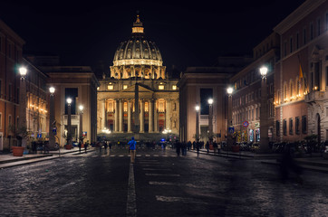 Fototapeta na wymiar Night view at St Peter's Basilica, one of the largest churches in the world located in Vatican city.