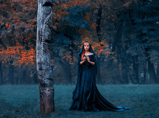 sad princess with red blond long hair dressed in green emerald expensive velvet royal cloak-dress...