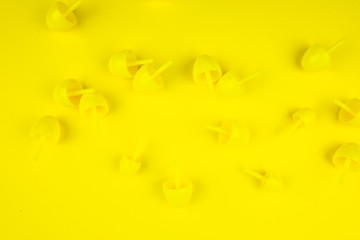 Yellow mosaic pieces for kids on a yellow background. 