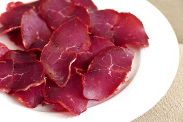 veal bacon, thinly sliced veal bacon, white background