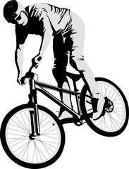 isolated man doing bike trick