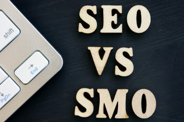 SEO vs SMO and keyboard on a dark desk.