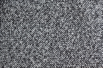 Fototapeta premium The texture of coarse gray fabric. Fabric for sewing outerwear_