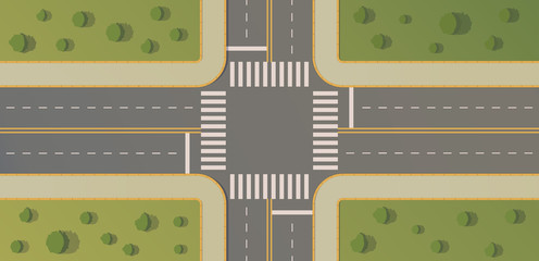 Crossroads of two roads with pedestrian paths, curbs and boards, road markings, grass, bushes and trees.
