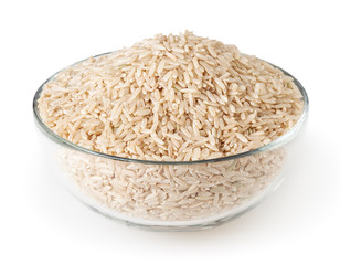 Brown rice in glass bowl isolated on white background with clipping path