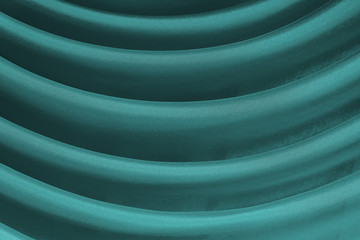 Horizontal folds on green organza curtains