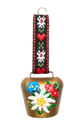 Switzerland souvenir. Closeup of colorful swiss cow bell with Edelweiss and gentian isolated on a white background. Macro.