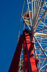 Attractions in spring city Park - Ferris Wheel Over Blue Sky