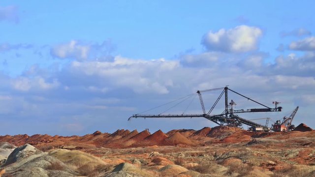 Spreader work. Production of manganese ore in the largest field in Europe. Open development.  Metallurgical industry in Ukraine, Nikopol distrikt.