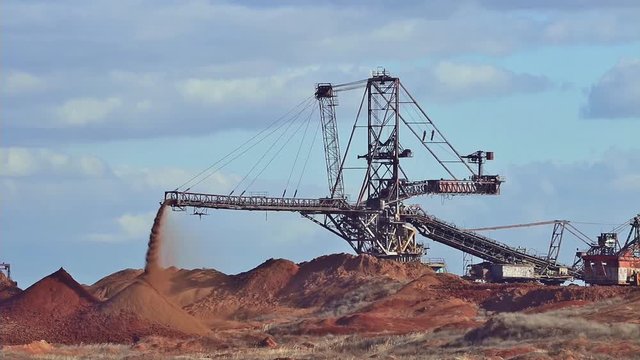 Spreader work. Production of manganese ore in the largest field in Europe. Open development.  Metallurgical industry in Ukraine, Nikopol distrikt.