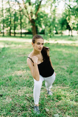 Young beautiful girl doing yoga outdoors in the park