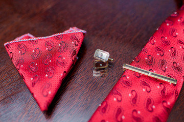 Wedding ceremony. Preparing the groom for the wedding. Tie and cufflinks. Leather Trouser belt. A...
