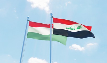 Iraq and Hungary, two flags waving against blue sky. 3d image