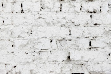 White brick wall with plaster.