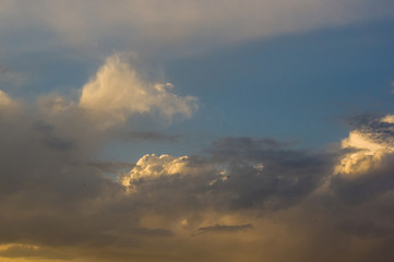 Obraz premium Landscape with dramatic light - beautiful golden sunset with saturated sky and clouds.