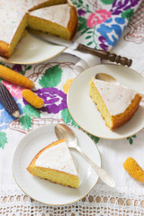 Traditional Romanian or Moldovan corn pie malay, with icing on a light background. Rustic style.