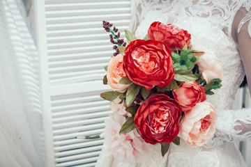 wedding bouquet in the hands of the bride