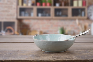 Bowl with spoon on the kitchen table