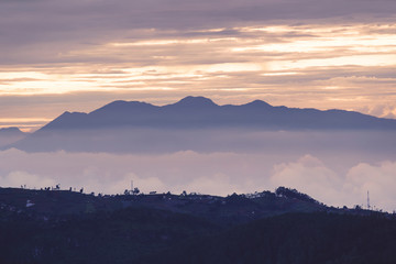 Misty mountain at dusk time in Bandung city