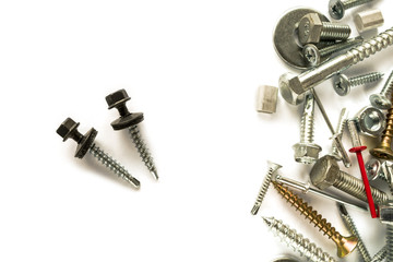 Flat lay of Self Drilling screws for roofing with a drill and with sealing washer  isolated on white. Self Drilling screws. Isolated fasteners. Connecting material on white background