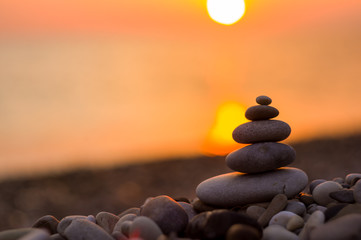 stack of zen stones on pebble beach