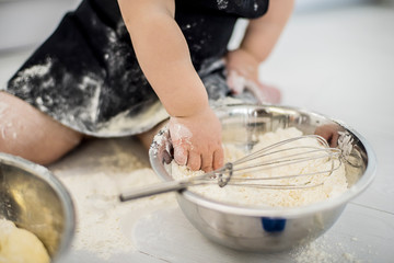 hands dough flour white floor child