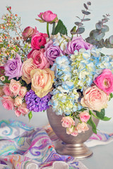 Beautiful bouquet of spring flowers in a vase on the table. Lovely bunch of flowers .