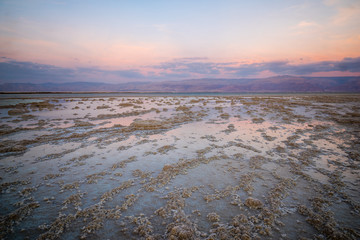 Sunset view of salt formations in the Dead Sea