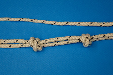 Rope breaking isolated over a blue background