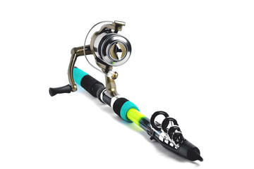 fishing reel on a fishing rod, white background close-up