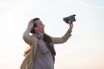 young woman vlogger recording her video outdoors