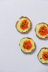 Caviar sandwiches isolated on white