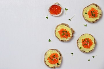 Caviar sandwiches isolated on white